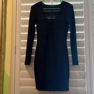 Black fitted dress. Long sleeve and breathable. As good as new—never worn.
